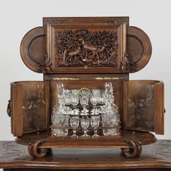 A Magnificent Carved Drinks Cabinet on Stand