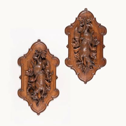 A Pair of Carved Black Forest Game Plaques