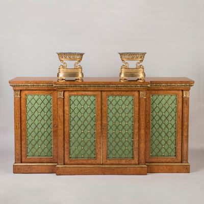A Regency Period Parcel Gilt and Amboyna  Breakfront Side Cabinet