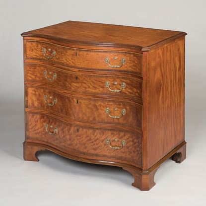 A Fine Satinwood Serpentine Chest of Drawers Of the George III Period