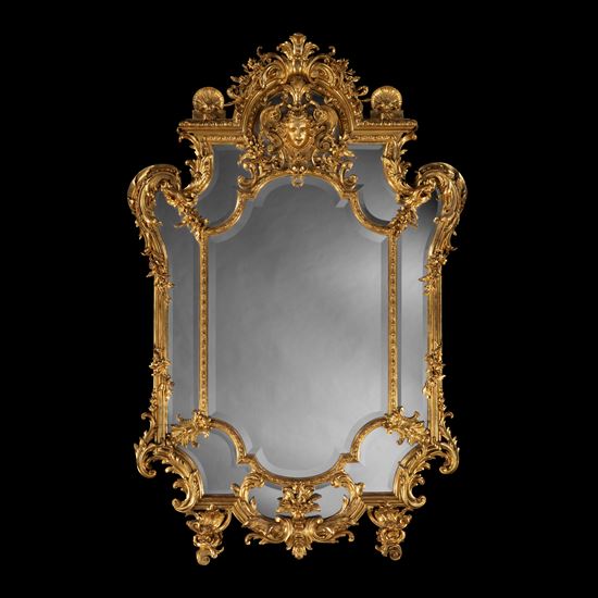 An Impressive Carved Giltwood Mirror In the Régence Style