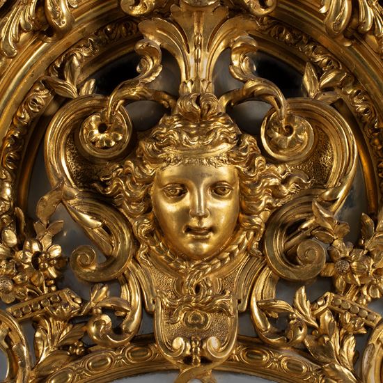 An Impressive Carved Giltwood Mirror In the Régence Style