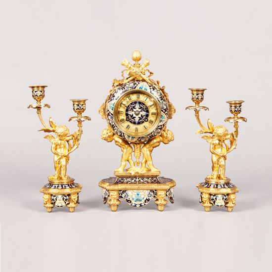 ​​​​​​​A French Mantle Clock Garniture in the Louis XVI Manner