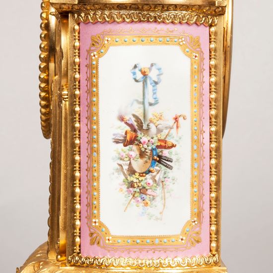 An Ormolu and Porcelain Mantle Clock Retailed by E&S Watson of London