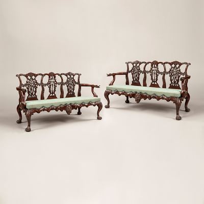 A Pair of Carved Mahogany Settees