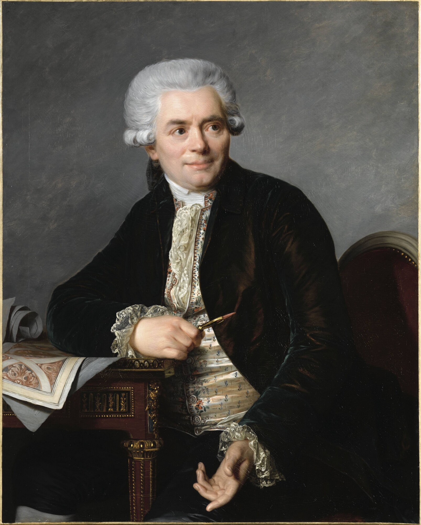 Rectangular portrait depicting Jean-Henri Riesener at his work table. The cabinetmaker is holding a sanguine pencil, sketching a design for an ornament.