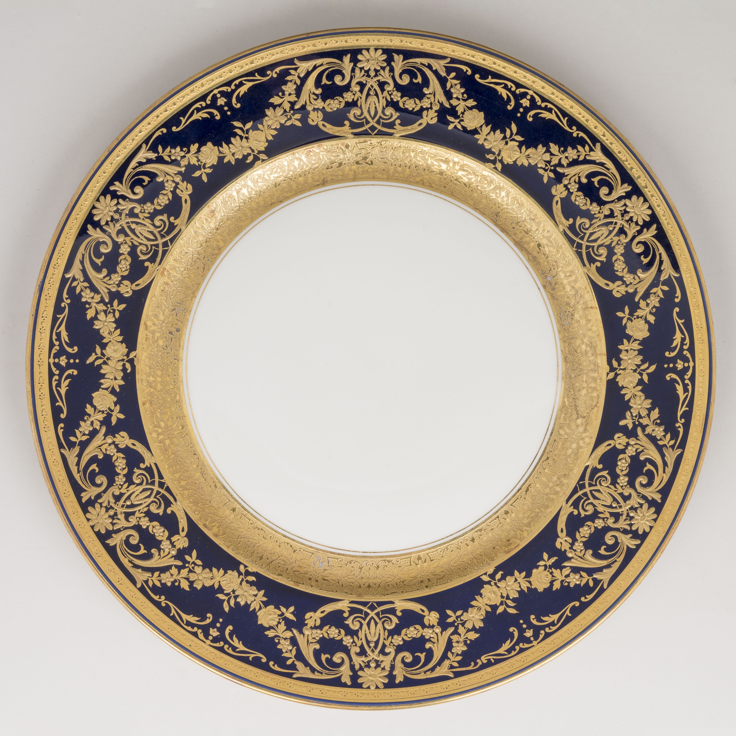 A Fine Set of 12 Blue & Gilt Porcelain Dinner Plates