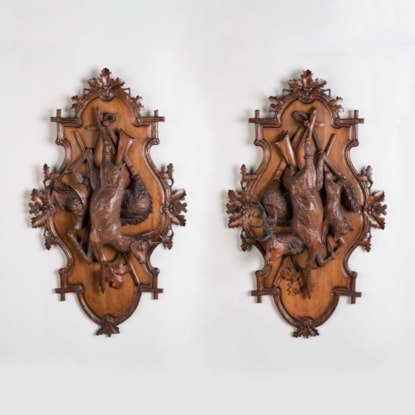 A Pair of Carved Black Forest Game Plaques