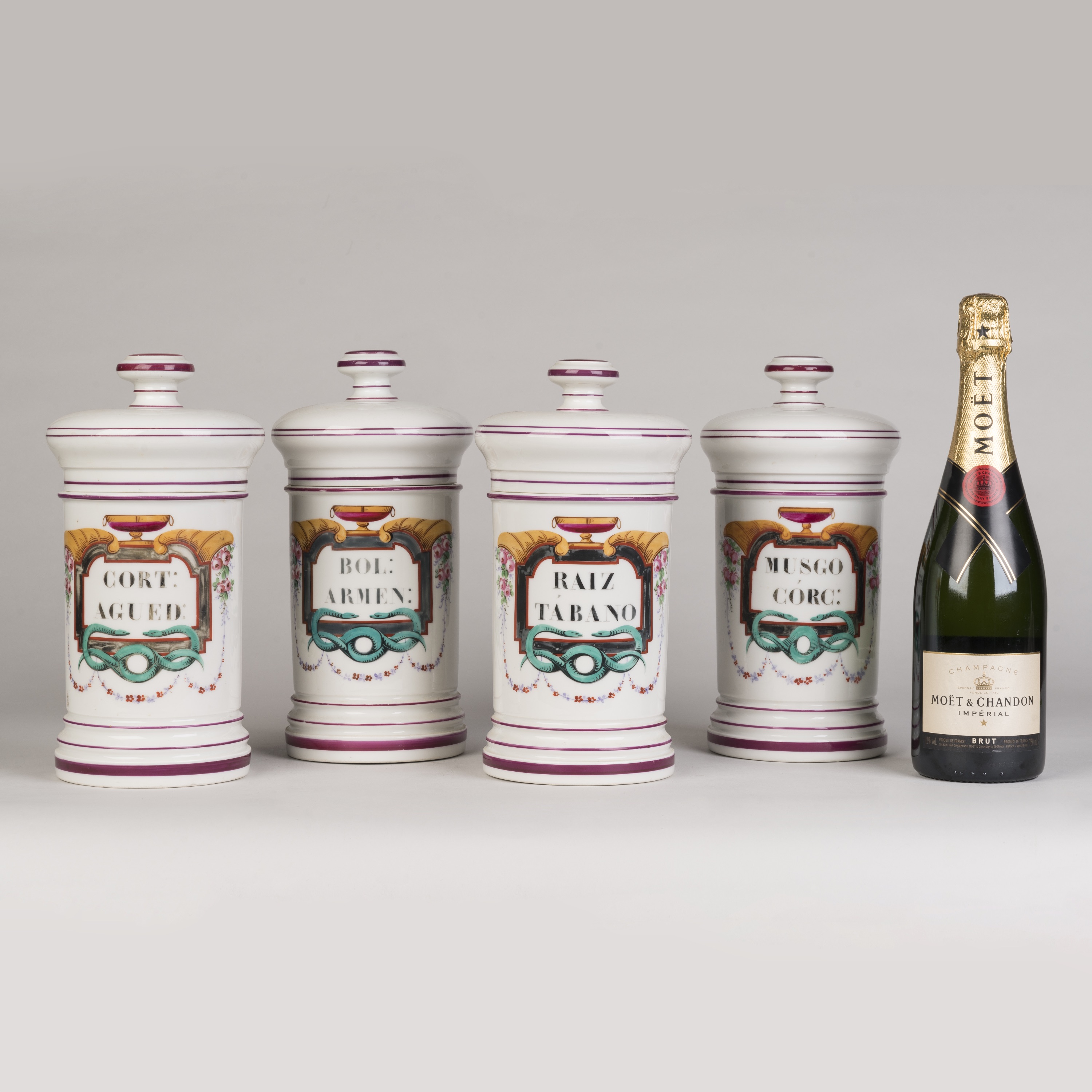 A set of Four Paris Porcelain Apothecary Jars by Maison Collin