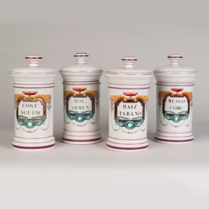 A set of Four Paris Porcelain Apothecary Jars by Maison Collin