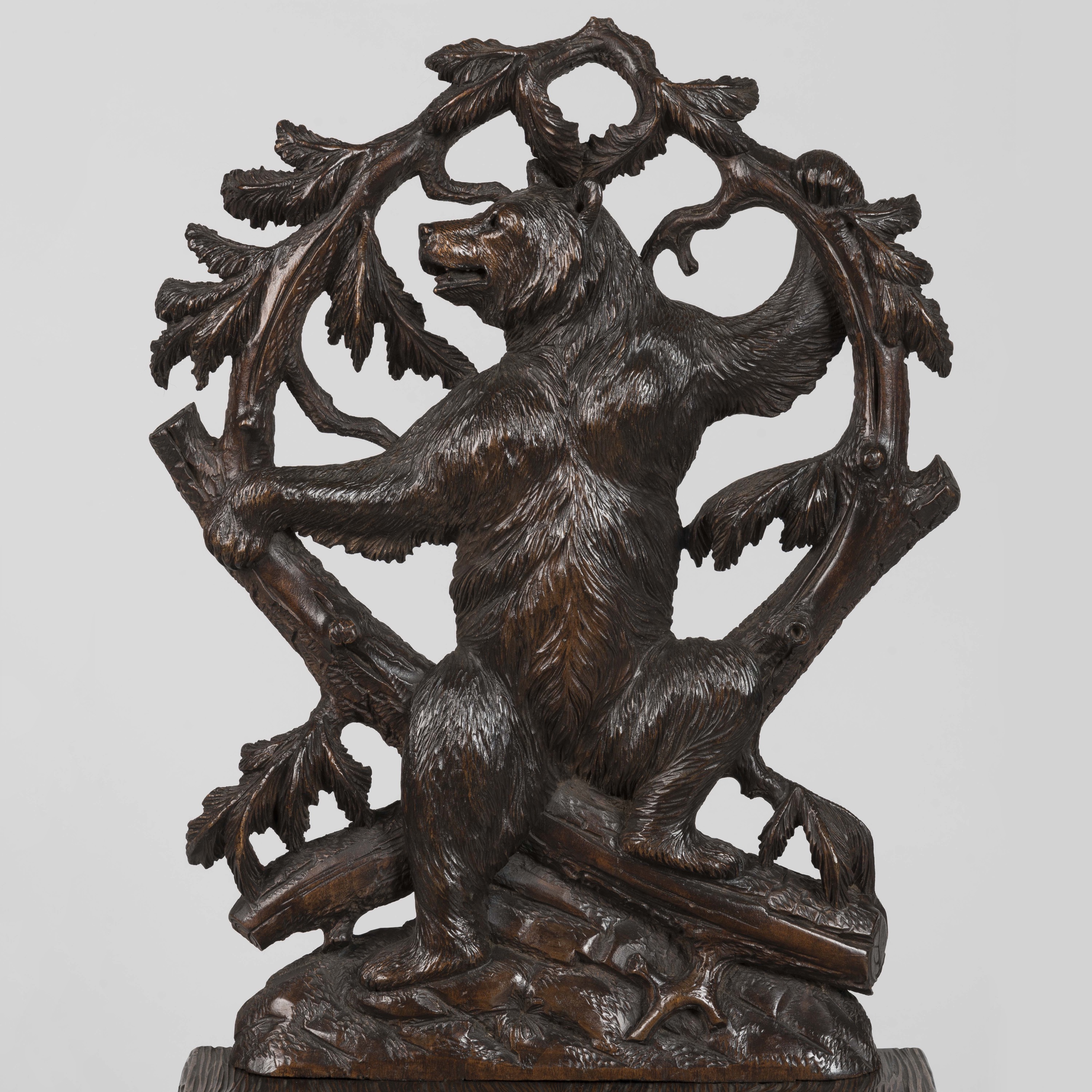 A Pair of Carved Black Forest Chairs