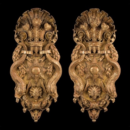 A Pair of Carved Giltwood Plaques After the design by William Kent