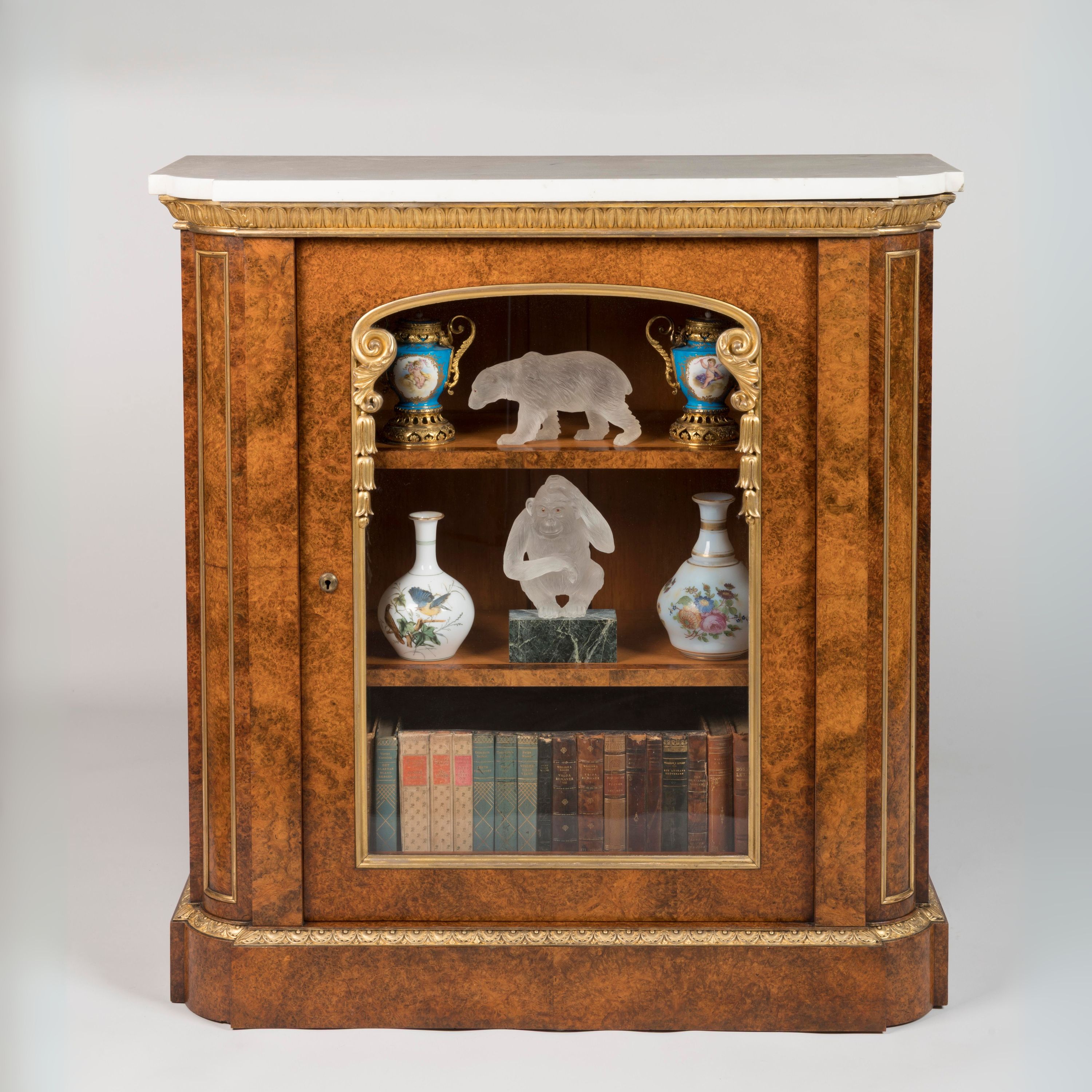 A Pair of Parcel Gilt Amboyna Cabinets By T & G Seddon