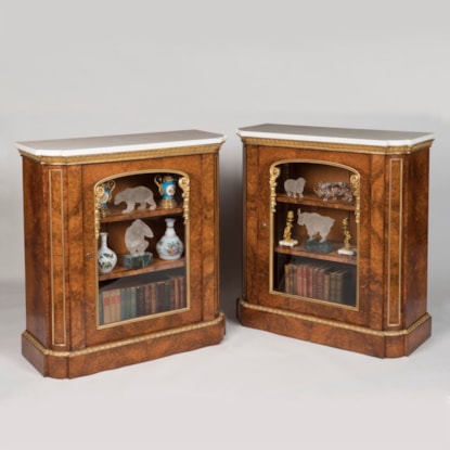 A Pair of Parcel Gilt Amboyna Cabinets By T & G Seddon