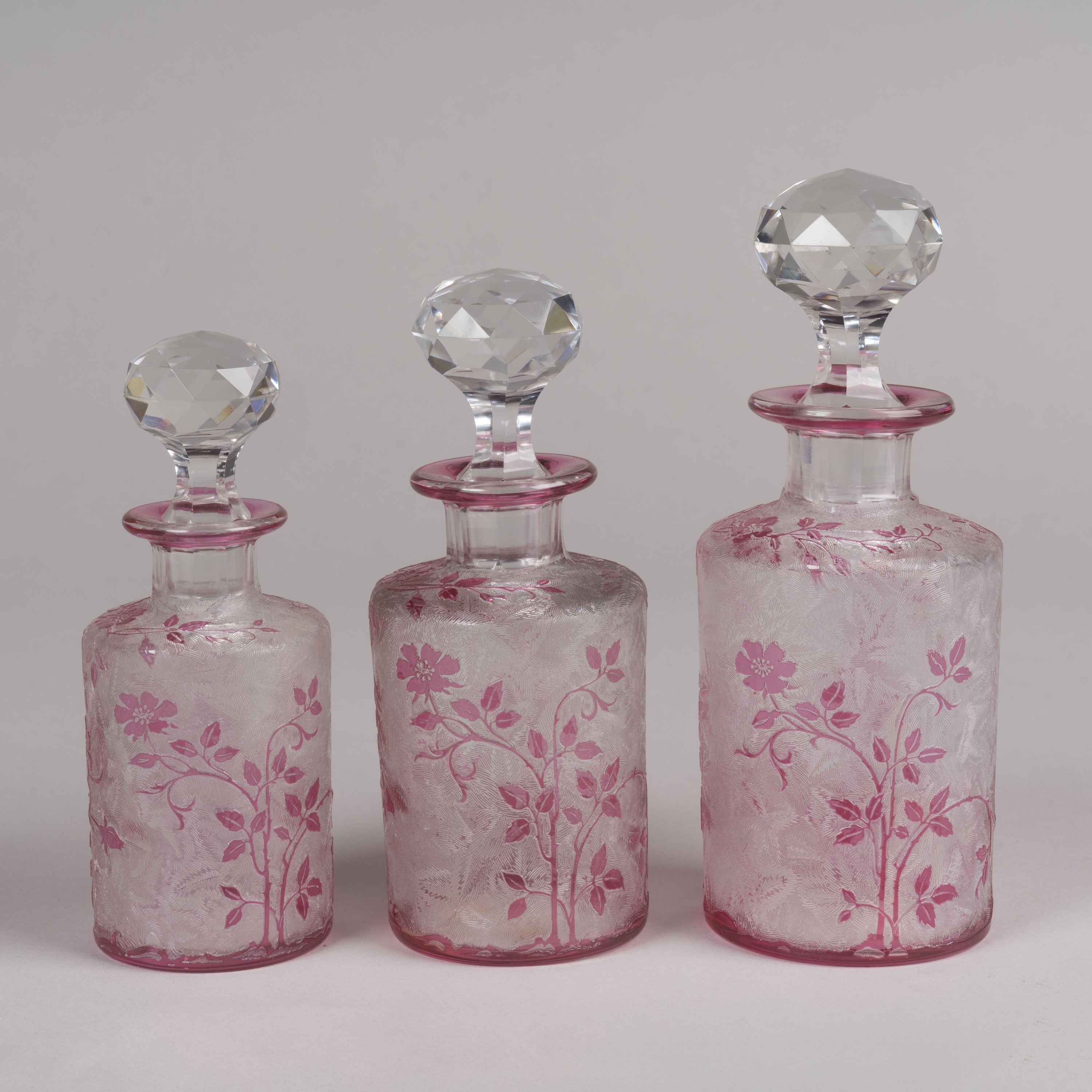 A Set of Six 'Wild Rose' Perfume Bottles