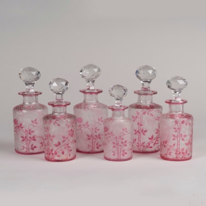 A Set of Six 'Wild Rose' Perfume Bottles