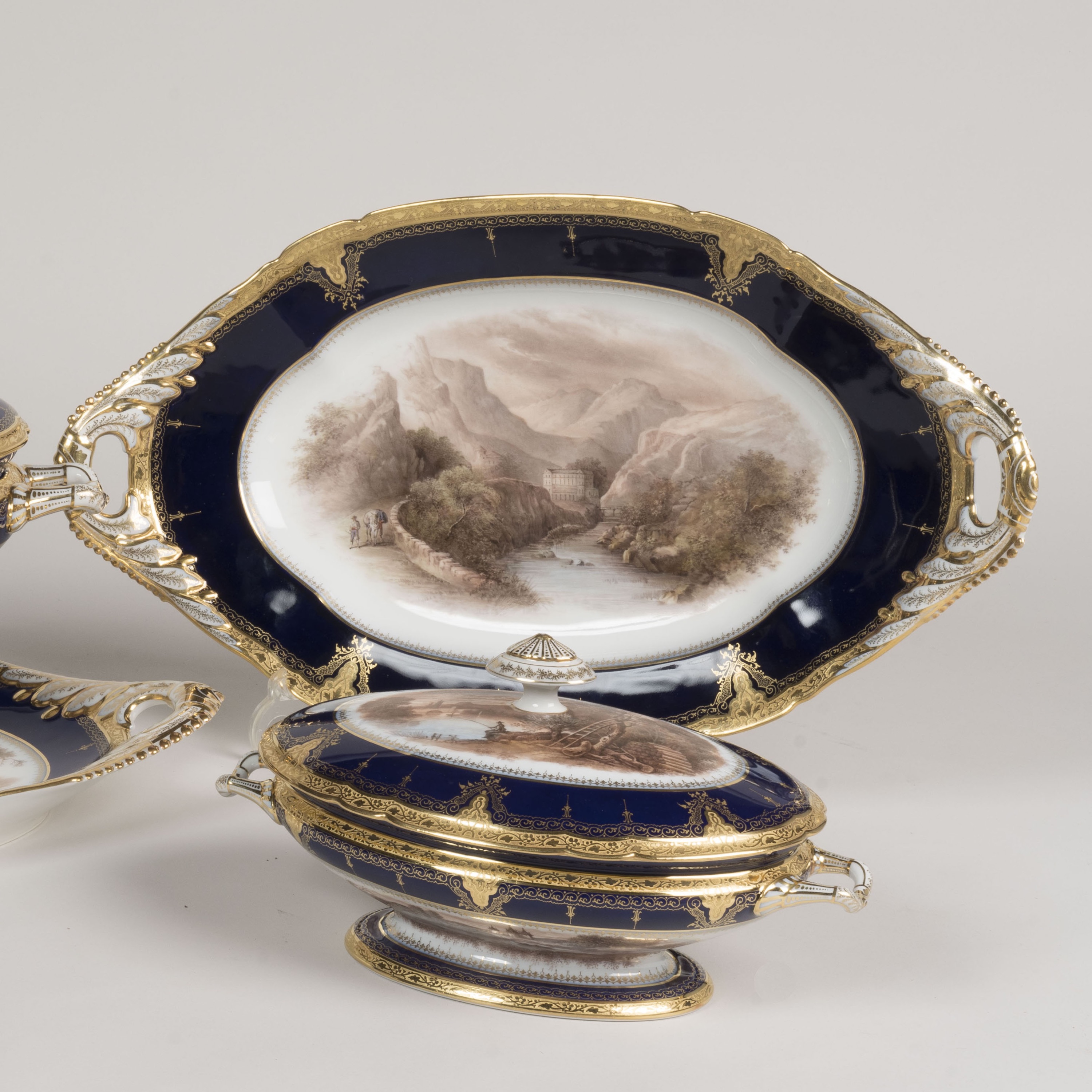 A Gilt & Grisaille Paris Porcelain Dinner Service Retailed by Bazar Frances