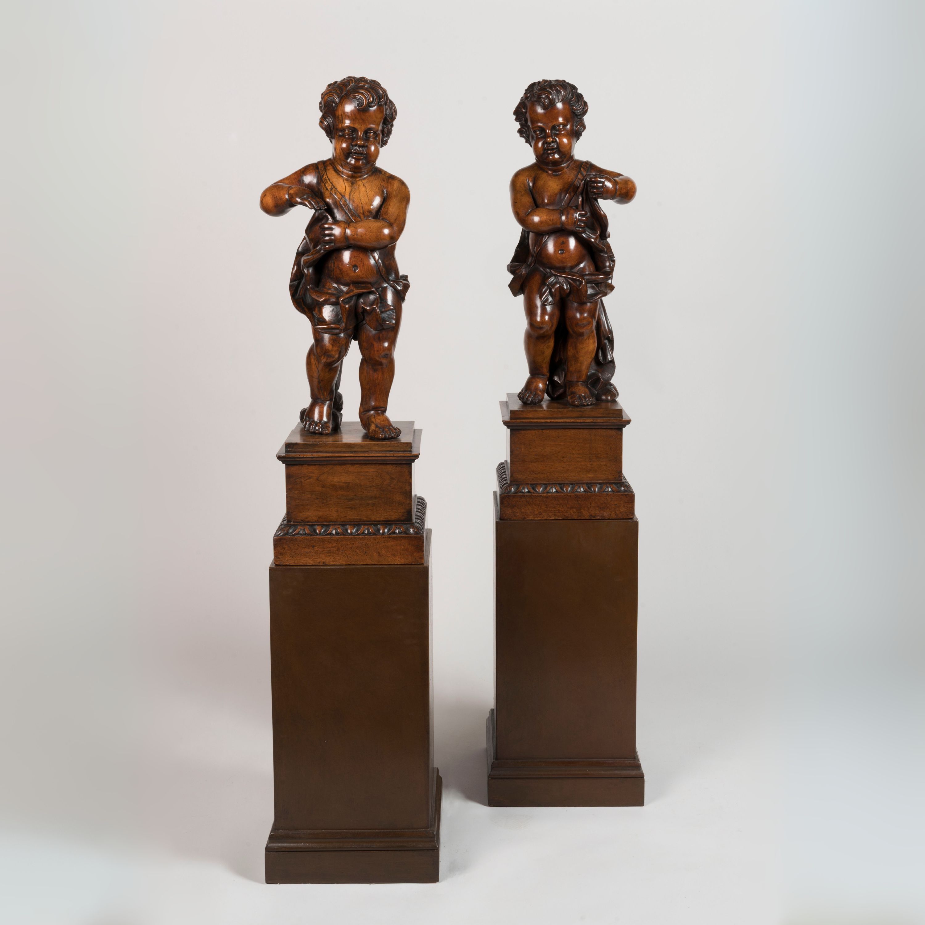 A Pair of Italian Carved Putti