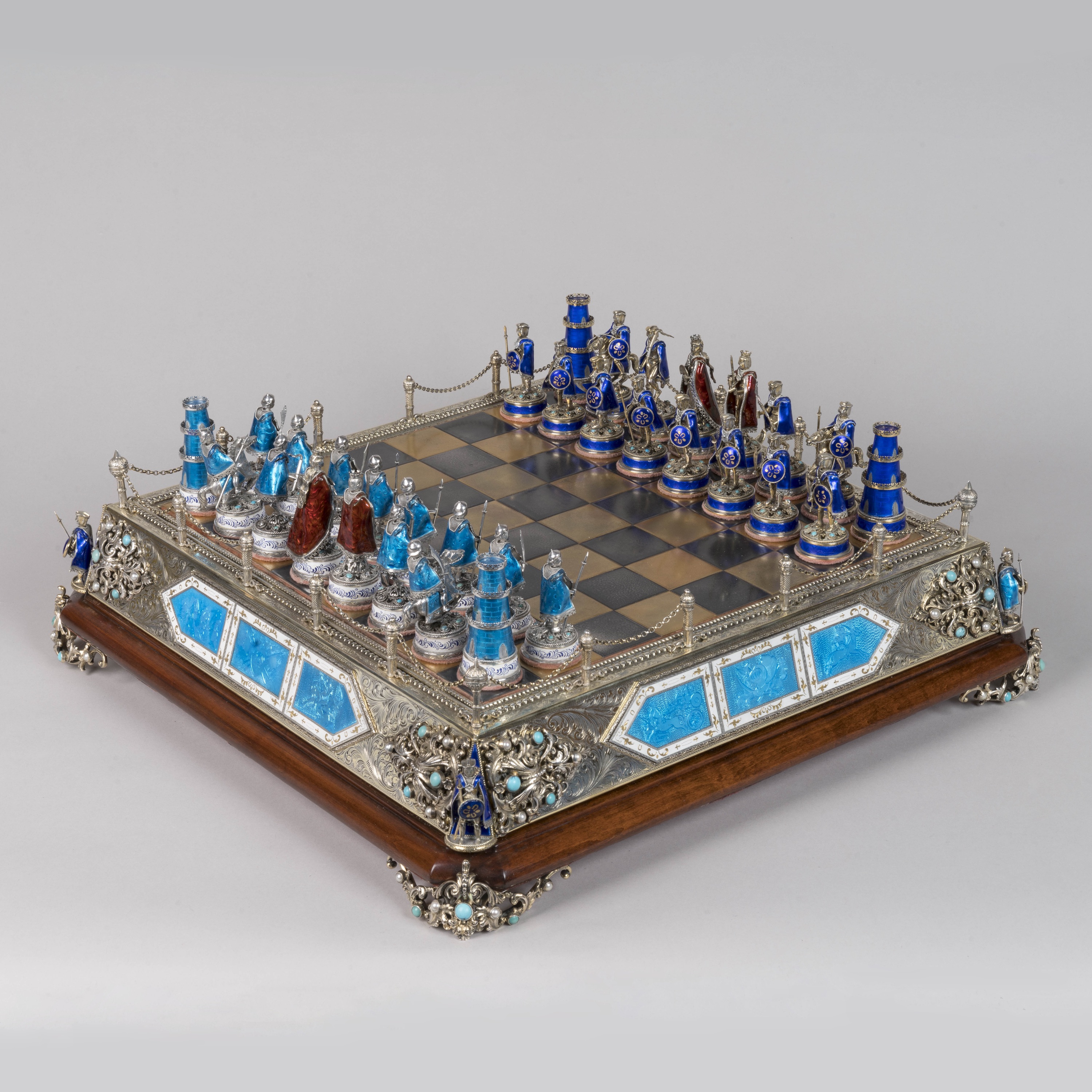 A Sterling Silver Gemstone-Inlaid Enamelled Chess Set