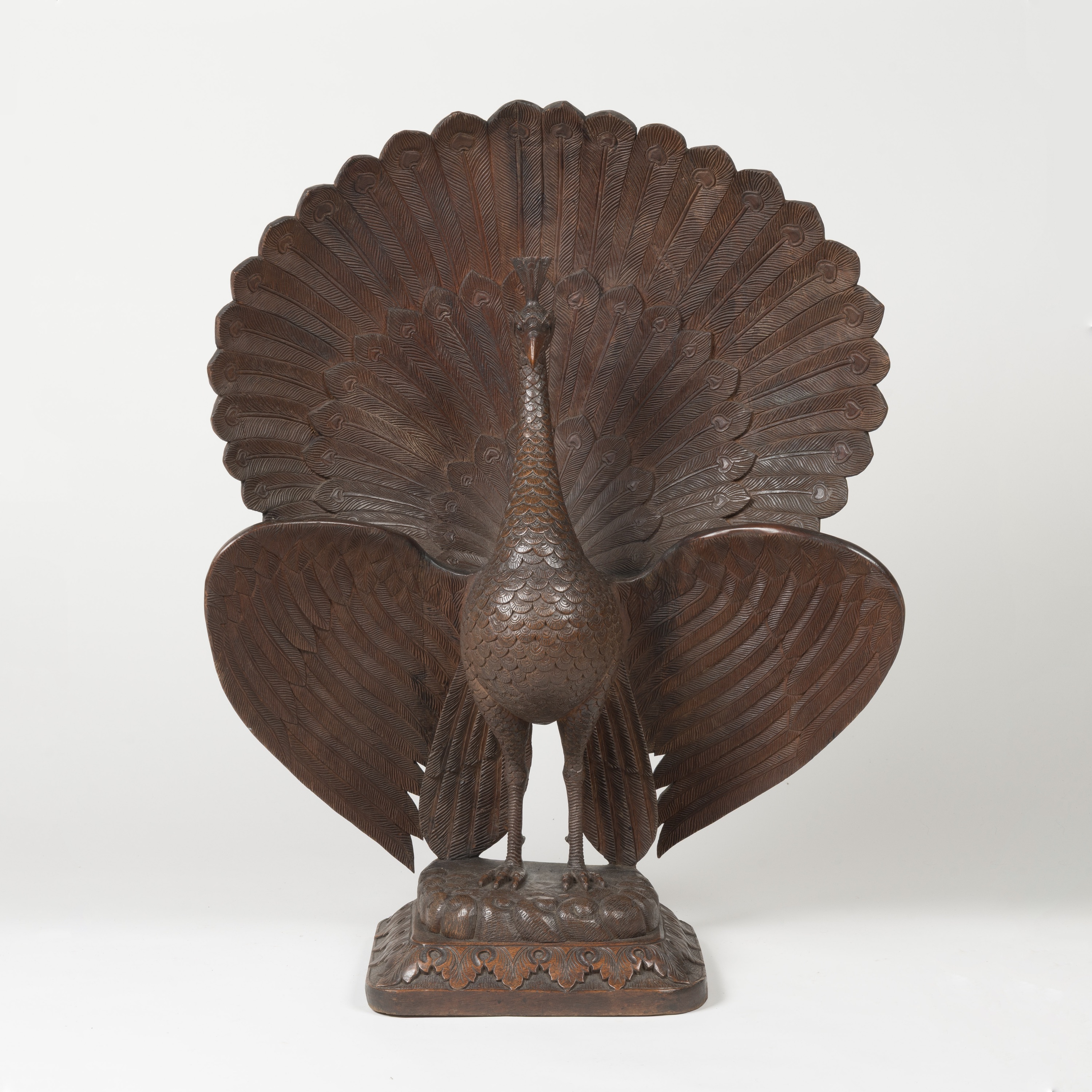 A Magnificent Colonial Sculpture of a Fanning Peacock