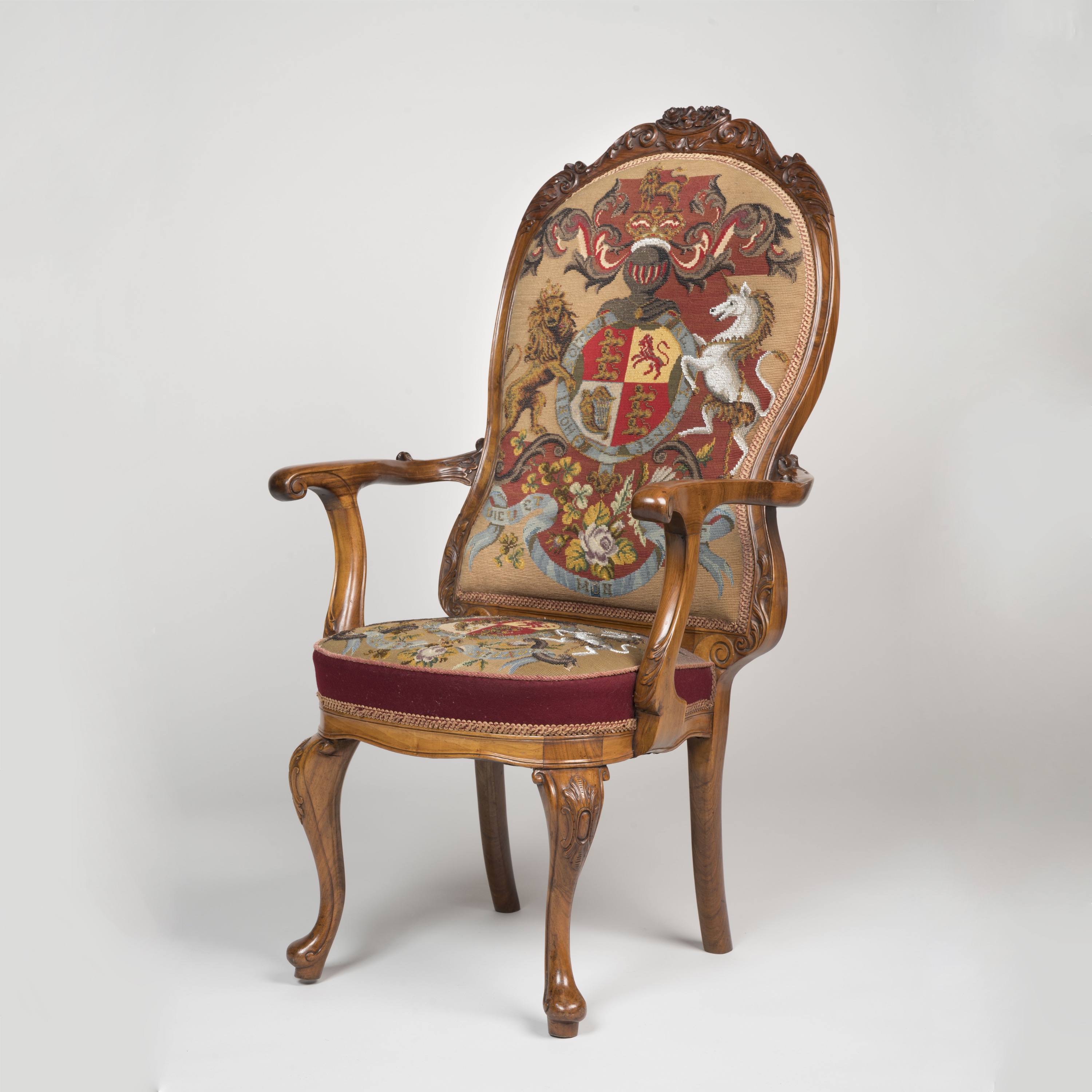 An Unusual Carved Walnut Open Armchair Bearing the Royal Coat of Arms