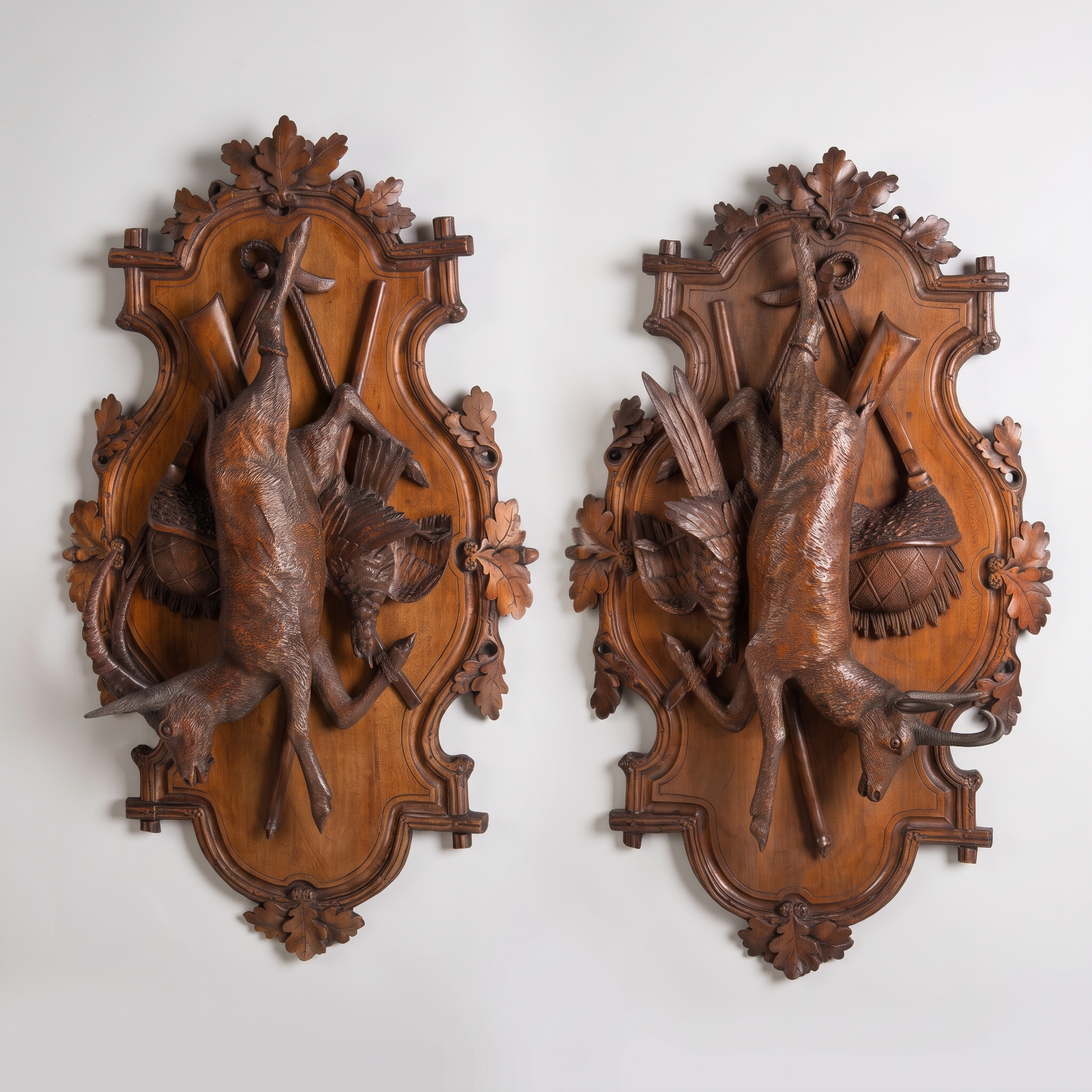 A Pair of Carved Black Forest Game Plaques