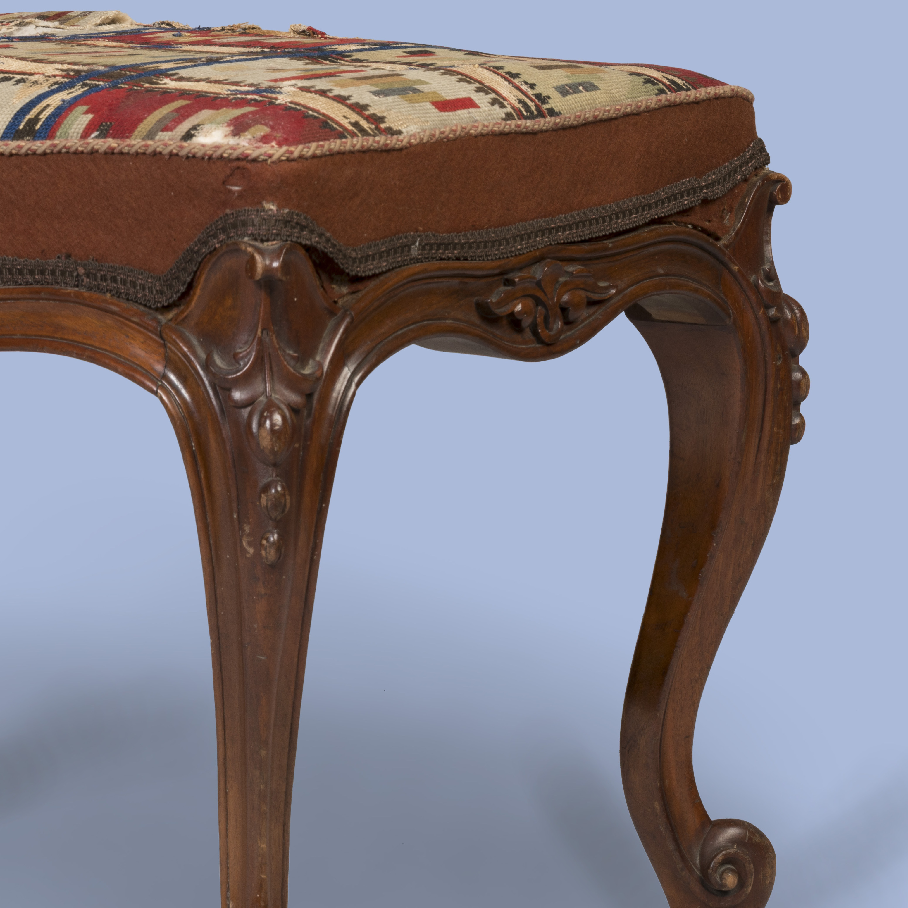 A Carved Walnut Stool