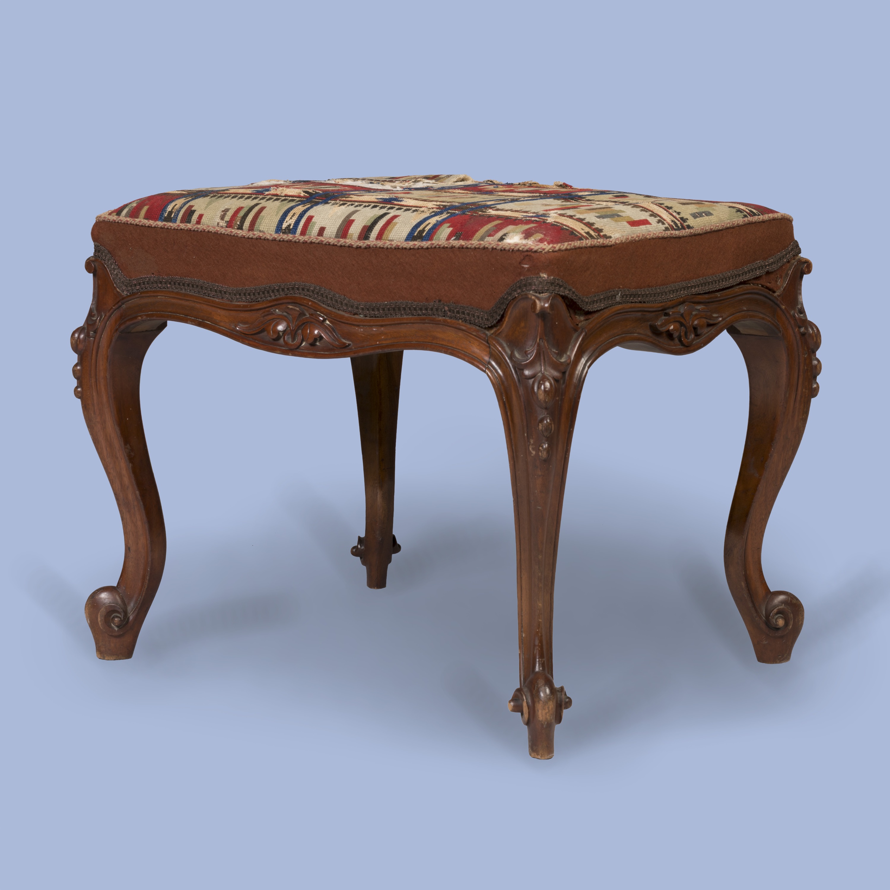 A Carved Walnut Stool