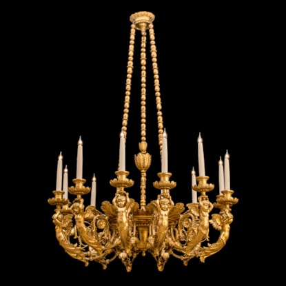 A Carved Giltwood Twelve Light Chandelier