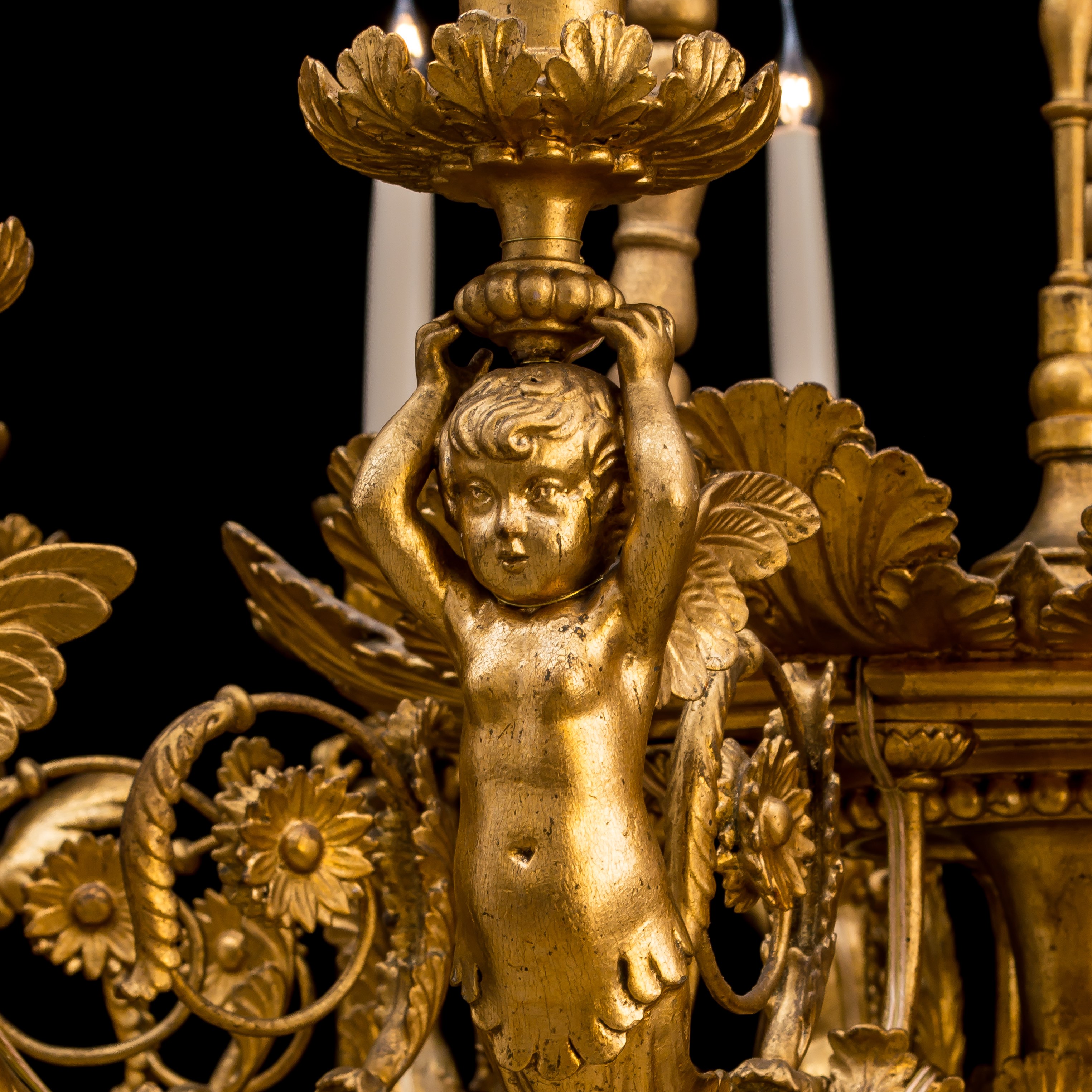 A Carved Giltwood Twelve Light Chandelier