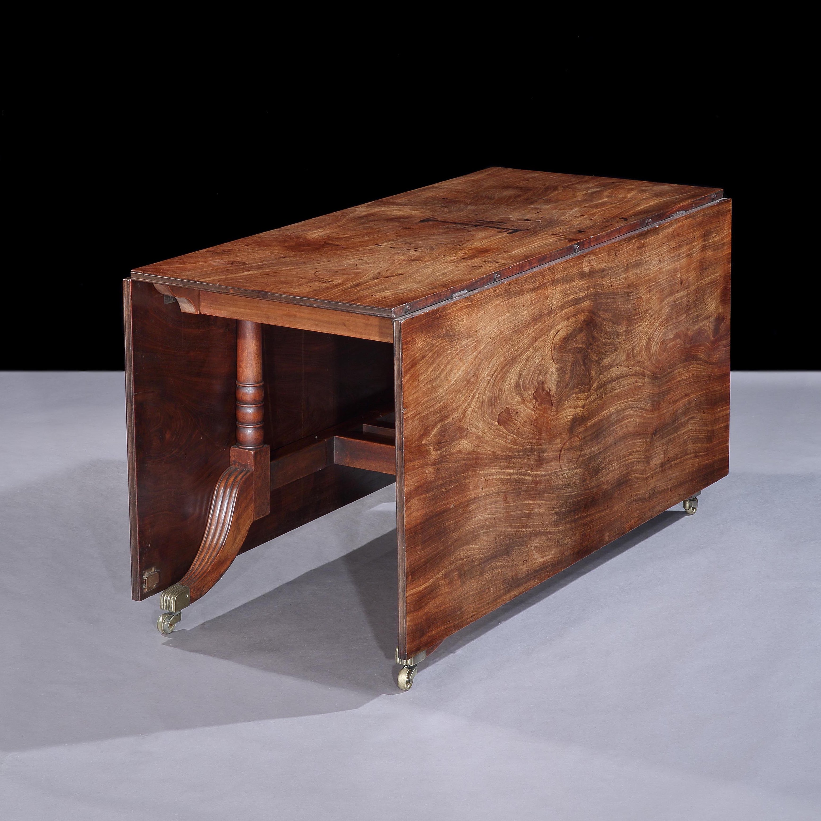 An Extending Dining Table of the Late Georgian Period