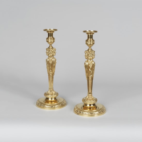 An Important Pair of Louis XVI Style Ormolu Candlesticks In the manner of Pierre Gouthière