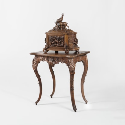 A Magnificent Carved Drinks Cabinet on Stand