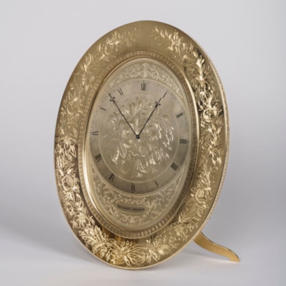 A Large Oval Strut Clock By Thomas Cole
