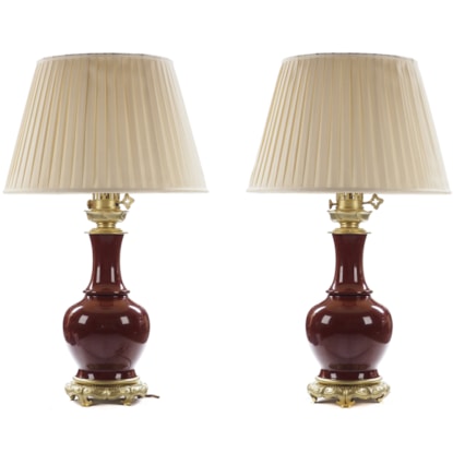 A Pair of Chinese Sang de Boeuf Porcelain Vase Lamps
