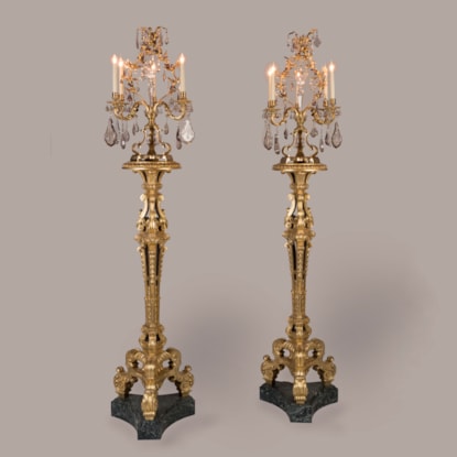 A Pair of Giltwood Carved Torchères