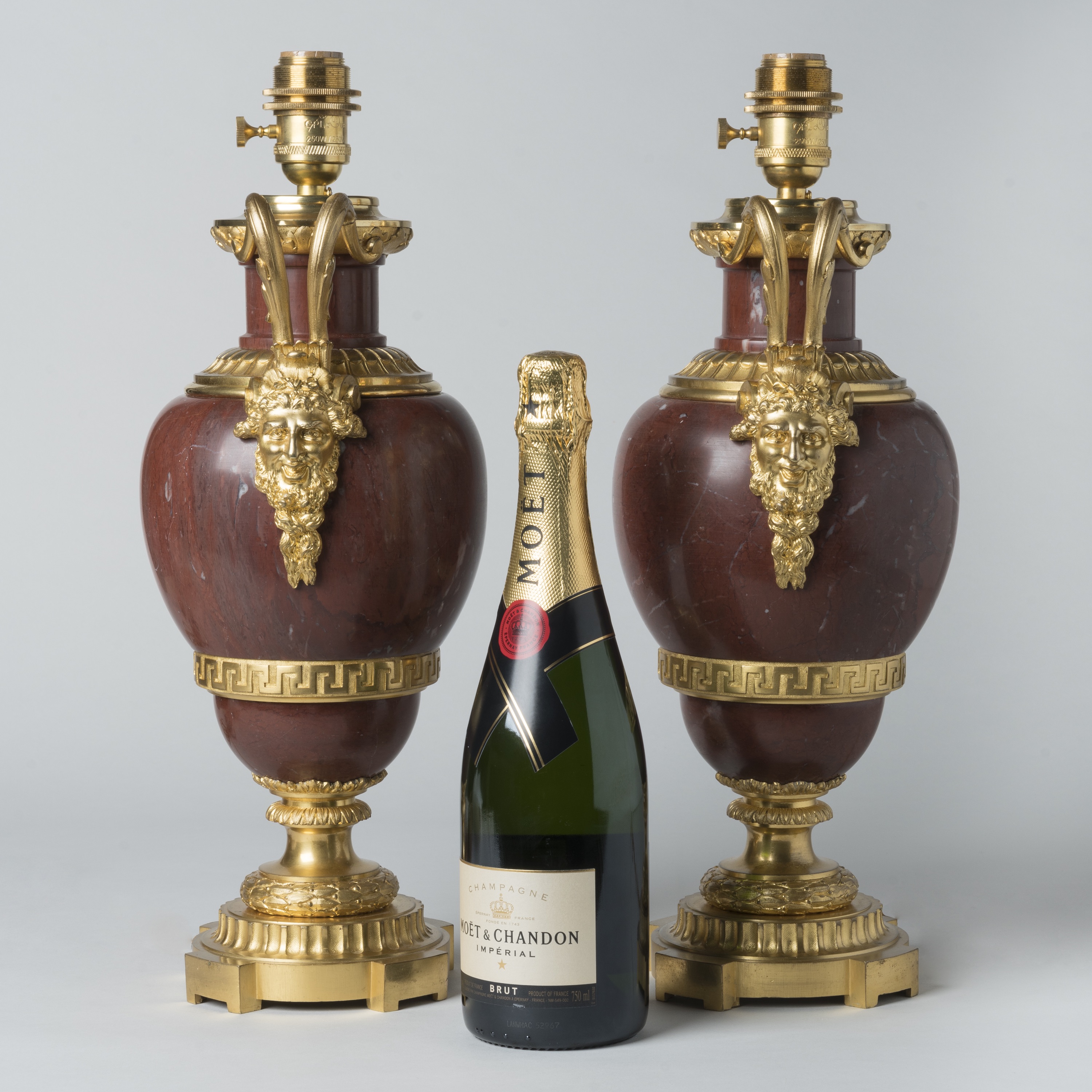 A Pair of French Ormolu-Mounted Red Marble Lamps