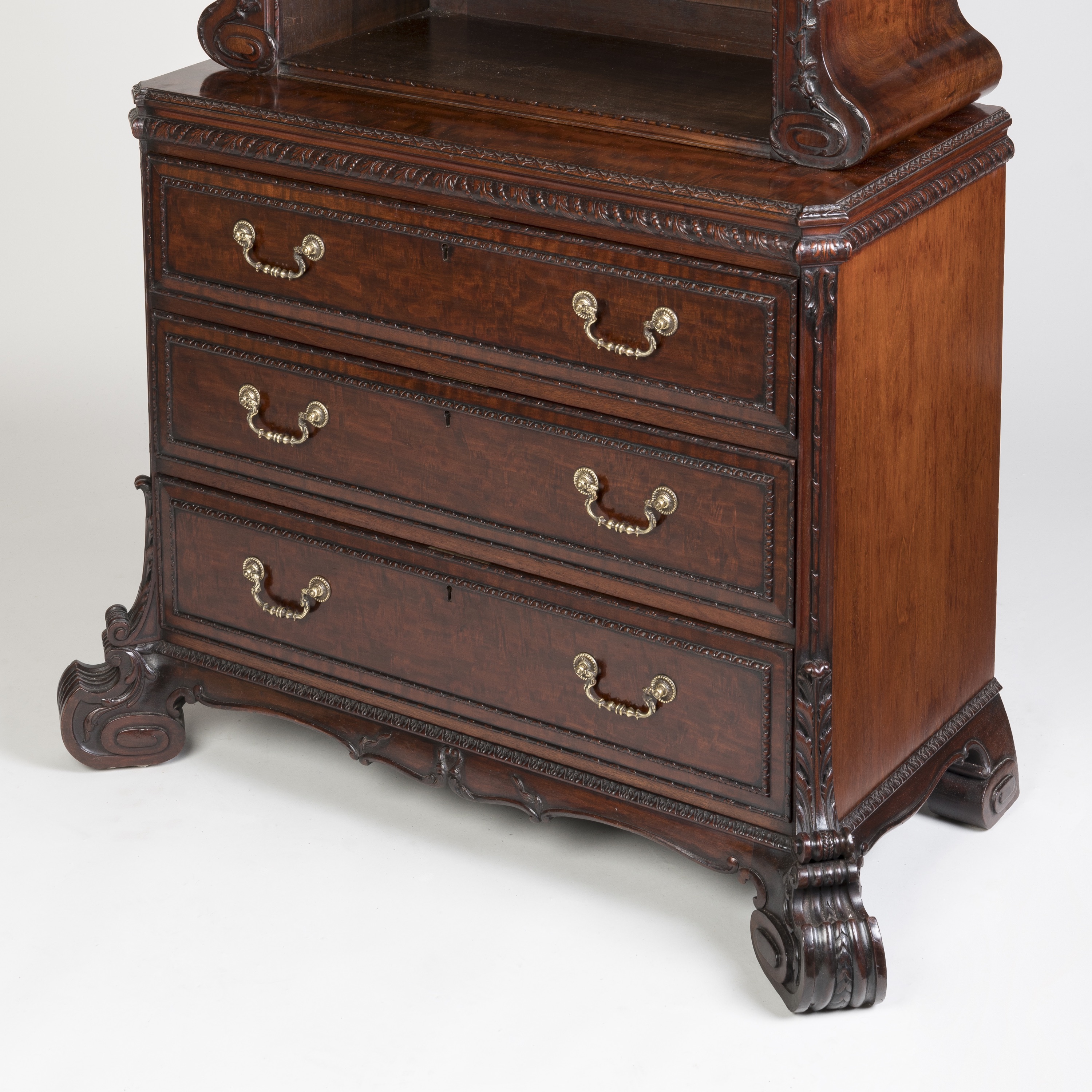 A Carved Mahogany Cabinet Bookcase in the George II Manner