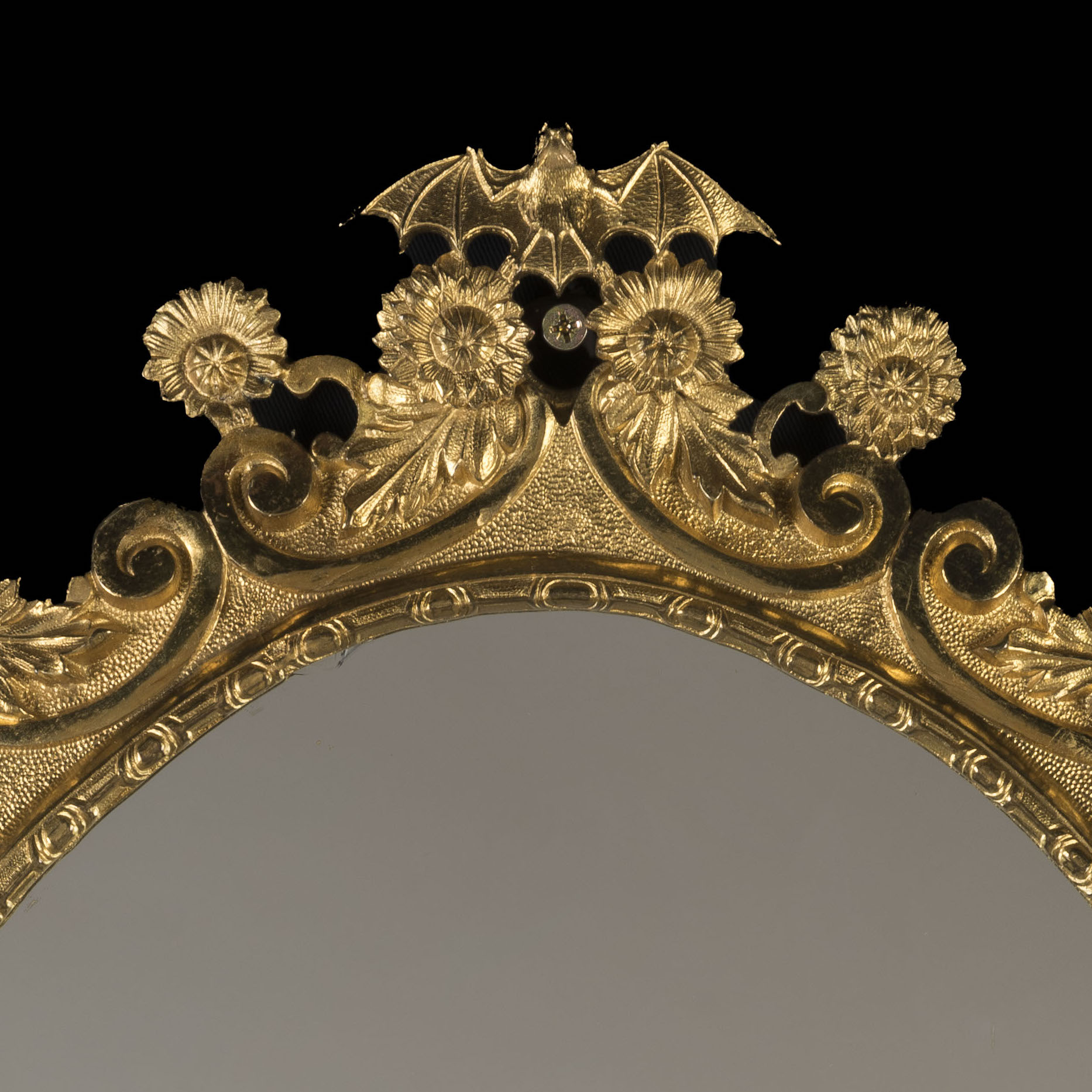 A Pair of English Ormolu Framed Oval Mirrors