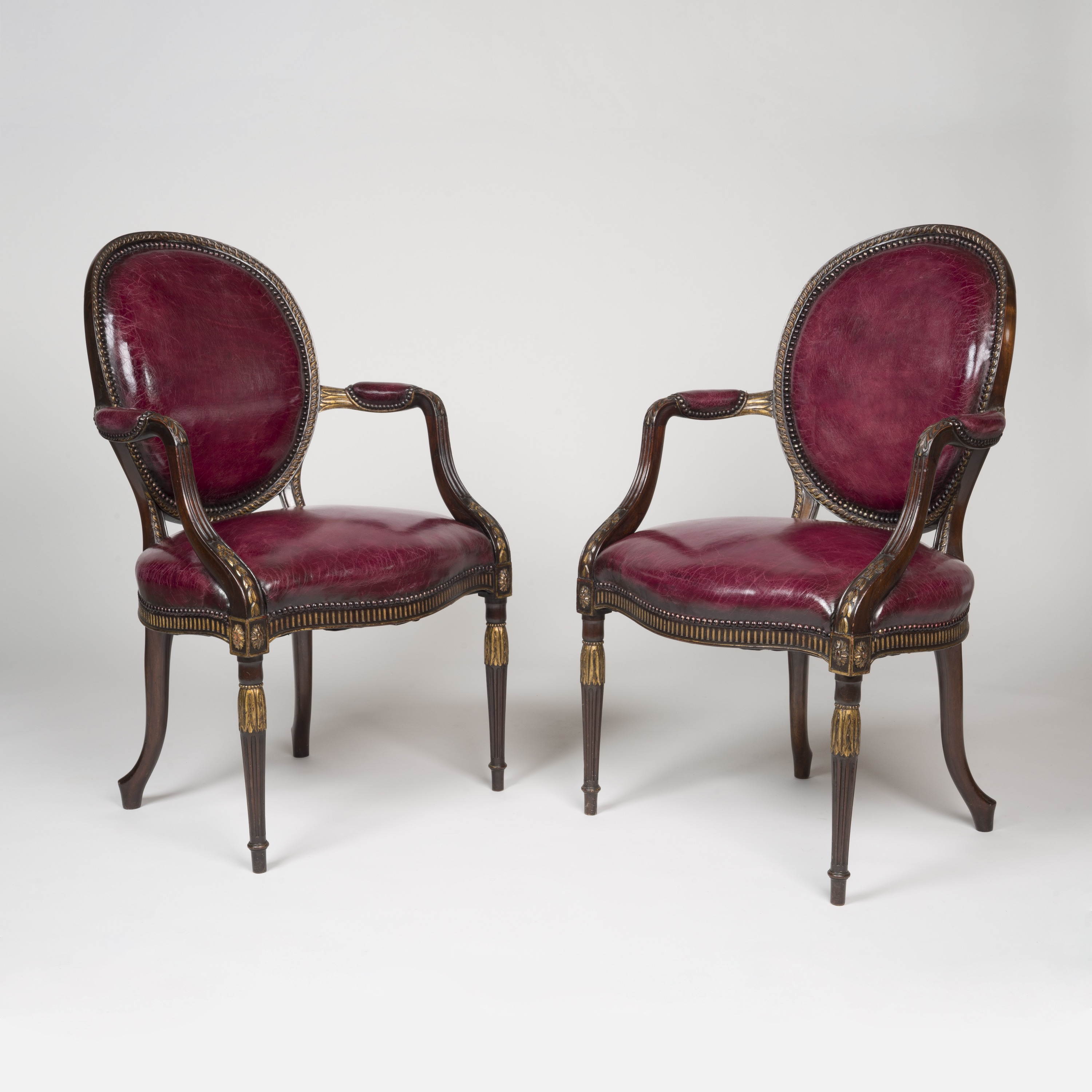 A Fine Pair of Armchairs in the Neo-classical manner of Robert Adam