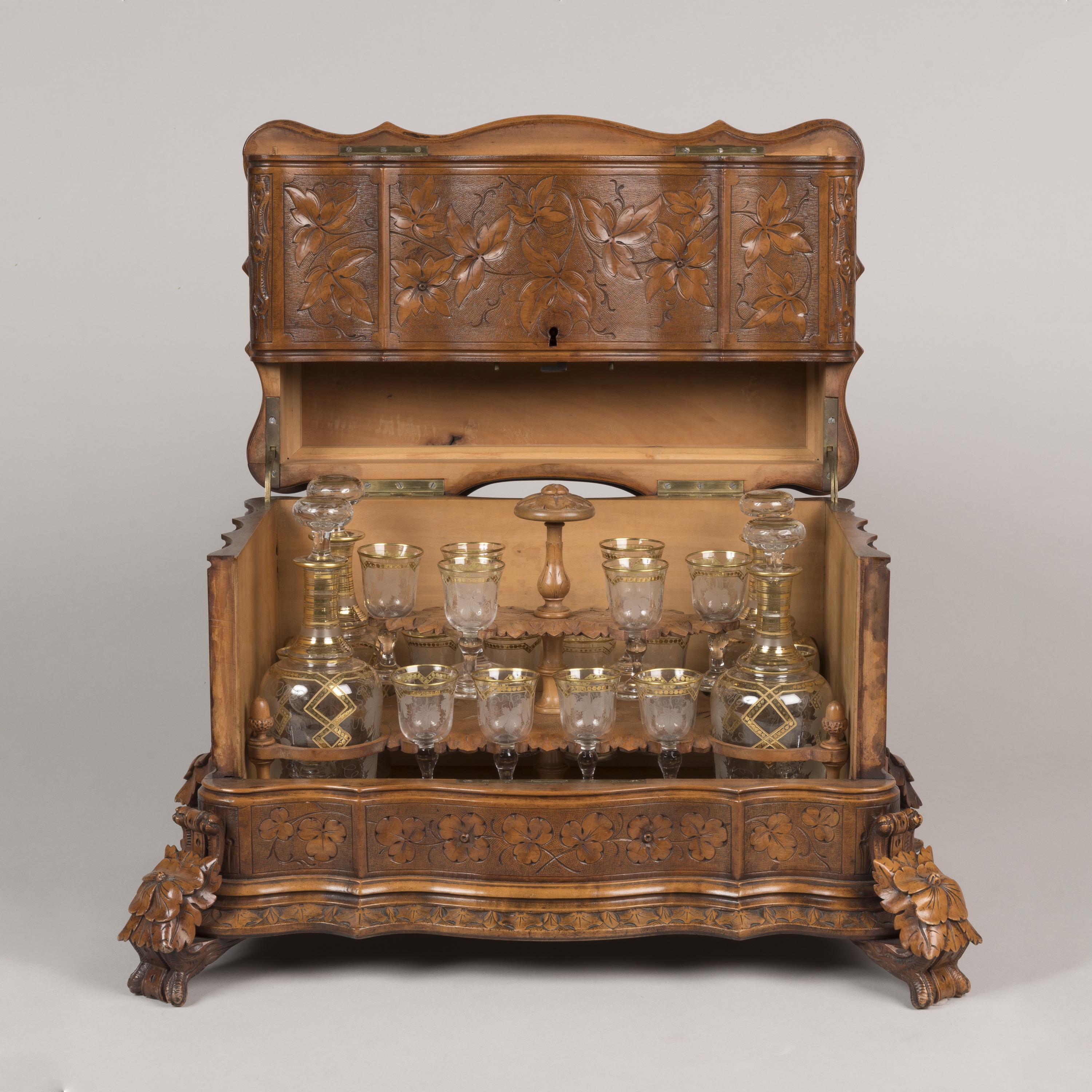 A Magnificent 'Black Forest' Carved Table-Top Drinks Cabinet