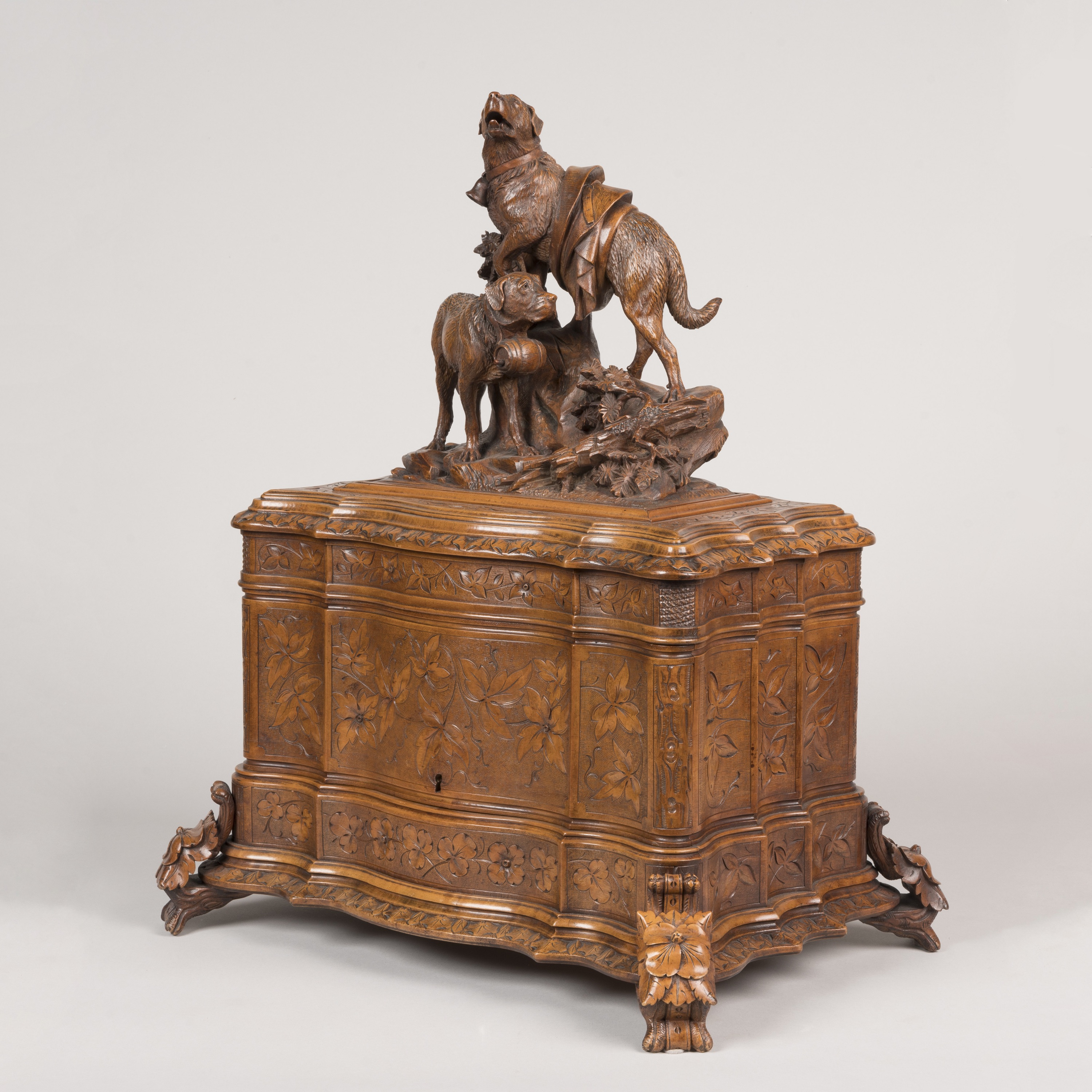 A Magnificent 'Black Forest' Carved Table-Top Drinks Cabinet