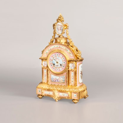 An Ormolu and Porcelain Mantle Clock Retailed by E&S Watson of London