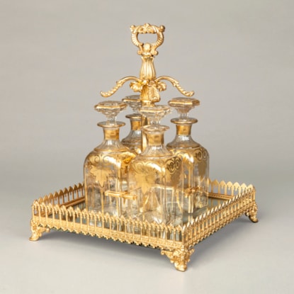 An Antique Crystal Glass and Ormolu Decanter Set