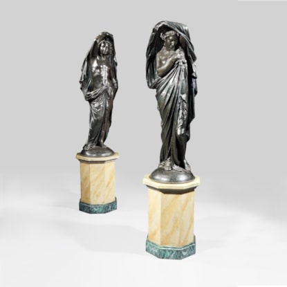 A Dramatic & Highly Decorative Pair of Statues in the Classical Manner