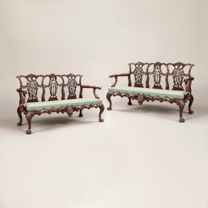 A Pair of Carved Mahogany Settees